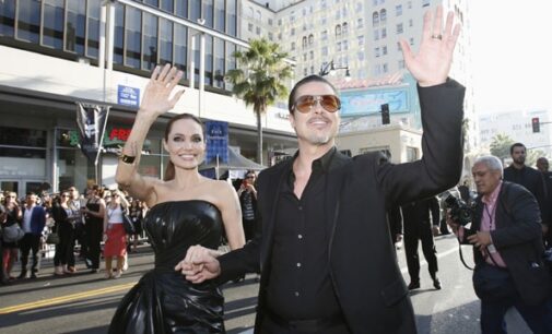 Crazy love! Overzealous fan lashes out at Brad Pitt on red carpet