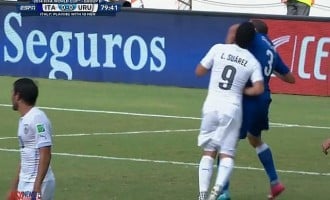 Suarez booted out of World Cup for biting Chielini