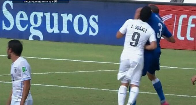 Suarez booted out of World Cup for biting Chielini