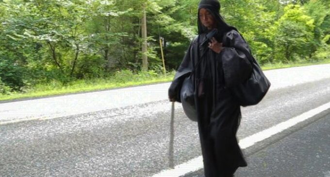 VIDEO: The mysterious woman in black walking across the US