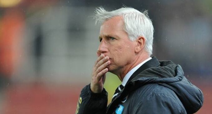 Alan Pardew, the sacked man warming the dugout