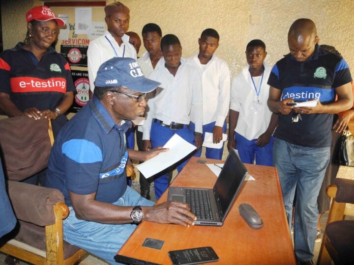 REGISTRAR, JOINT ADMISSIONS AND MATRICULATION BOARD (JAMB), PROF. DIBU OJERINDE (SITTED), ATTENDING TO CANDIDATES' COMPLAINTS OVER THE UNIFIED TERTIARY MATRICULATION EXAMINATION (UTME) AT JAMB OFFICE, BWARI IN ABUJA ON TUESDAY