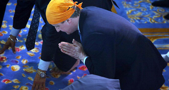 After attending Redeemed Church London vigil, David Cameron prays at Sikh temple