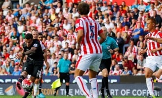 Liverpool win 1-0 at Stoke, West Ham stun Gunners