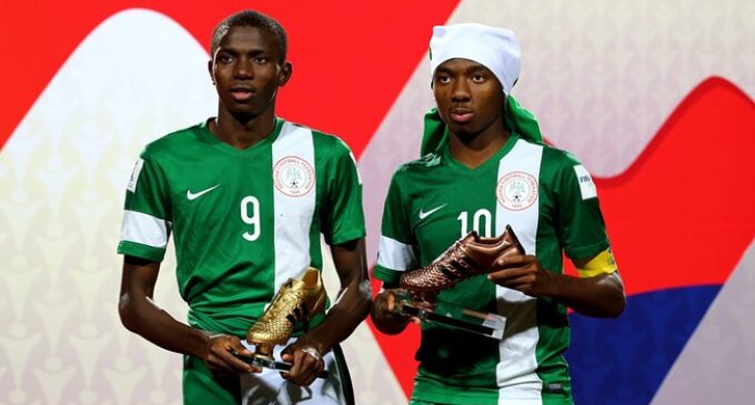 5 youth players flying the Nigerian flag proudly