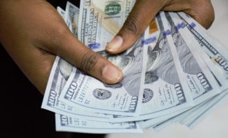 Gold struggles to shine as dollar firms