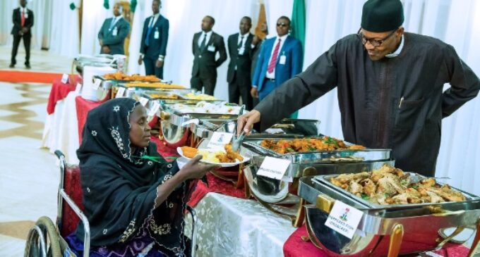EXTRA: Buhari ends Ramadan by personally serving food to IDPs, hairdressers, tailors