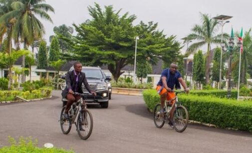 EXTRA: Okorocha abandons convoy, rides bicycle on streets of Owerri