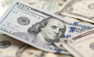 Dollar finds a friend in Powell as global stocks slip