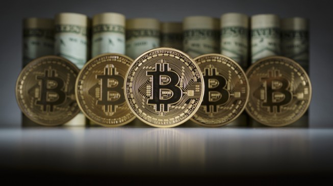 Global stocks under pressure; Bitcoin hits another record