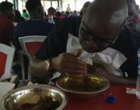 EXTRA: Fayose enjoys amala in Abuja restaurant