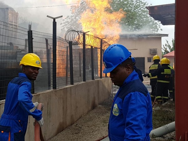 Firemen working to put out the inferno