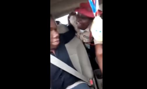 TRENDING VIDEO: FRSC officer struggles with driver of moving vehicle