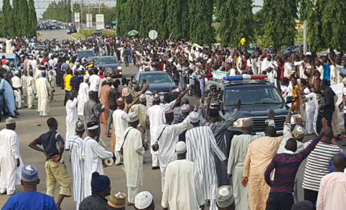 Pro-Buhari protesters block airport road