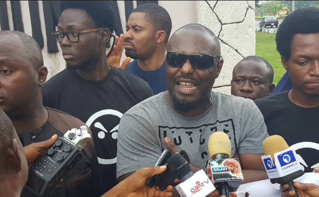 Jim Iyke addressing the protesters