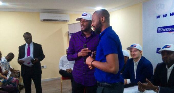 2baba, Olamide present cheques to Western Lotto winners
