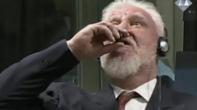 VIDEO: War criminal dies after drinking poison in court
