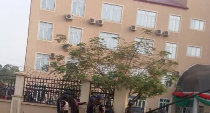PHOTO: Armed policemen on guard at hospital treating Buhari’s son
