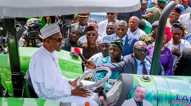 PHOTOS: Buhari drives tractor in Jos
