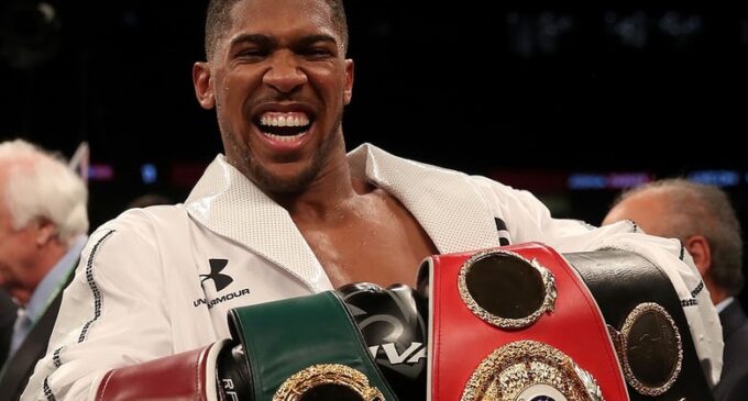 Joshua defeats Parker to unify three world heavyweight titles — and IBO crown