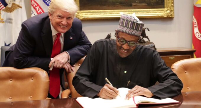 PHOTOS: Trump grins as Buhari signs White House register