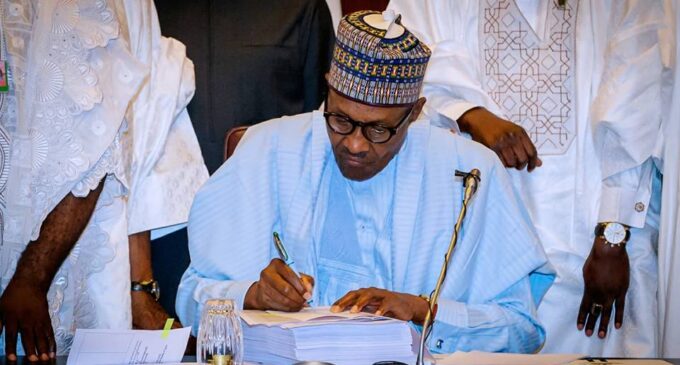 Buhari signs 2018 budget into law