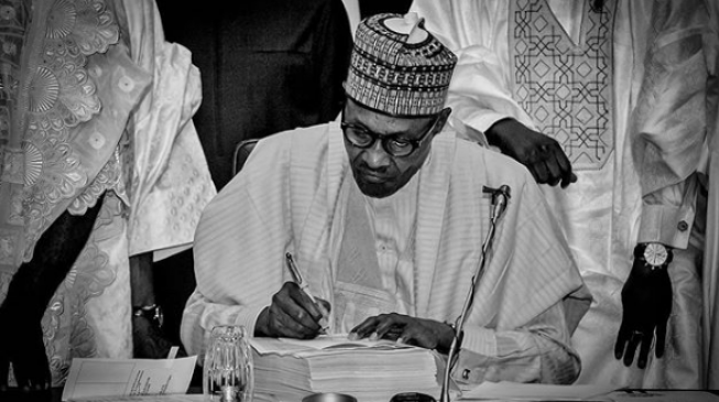VIDEO: The moment Buhari signed 2018 budget into law