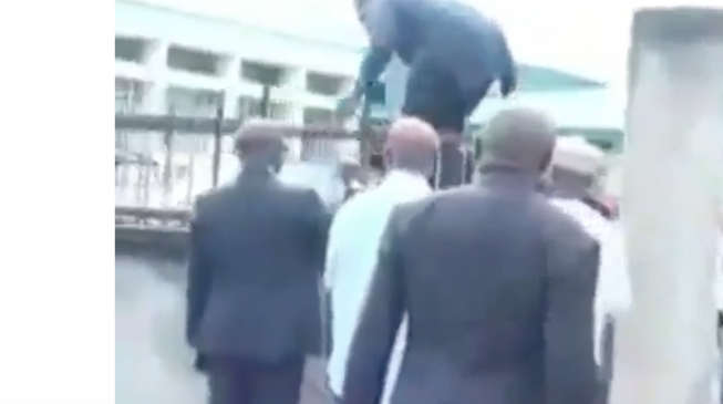 VIDEO: Benue lawmakers scale fence after police blockade