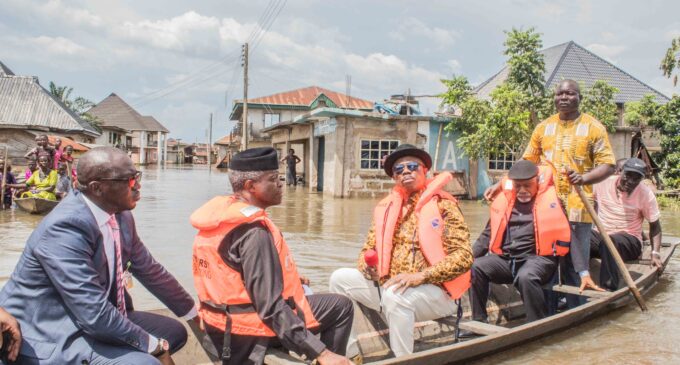 VIDEO: Osinbajo boards canoe to flood-ravaged Anambra community