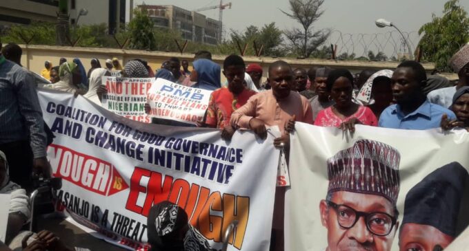 Protesters hit Abuja streets, accuse Obasanjo of instigating crisis