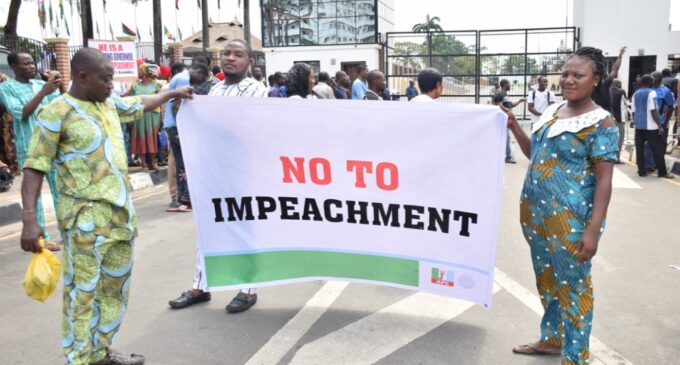PHOTOS: Ambode’s supporters storm Lagos assembly over impeachment move