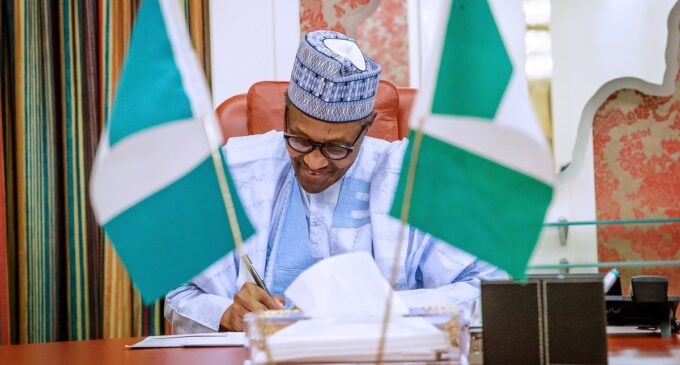 Workers to earn N30k as Buhari signs minimum wage into law