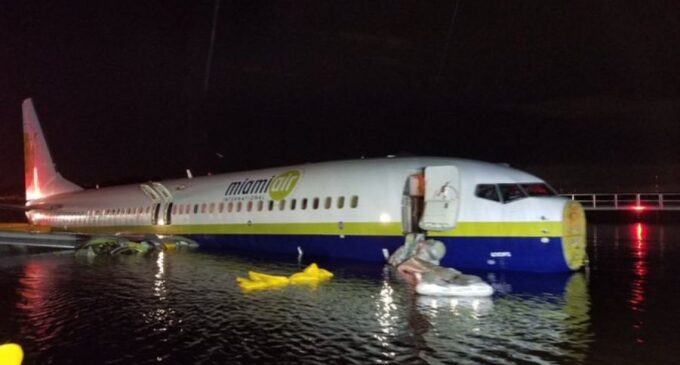 Plane with 143 passengers slides into Florida river