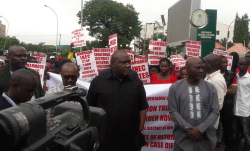 Senator-elect leads protesters to INEC headquarters over certificate of return