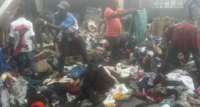 PHOTOS: Traders inspect wares after fire outbreak at Lagos market