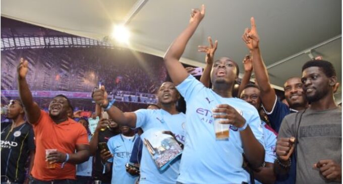 PHOTOS: Fans thrilled as Man City parade trophies in Lagos