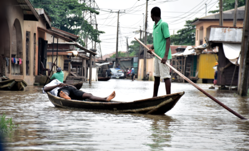 In flooded Lagos community, canoe replaces Uber and children are on forced holiday