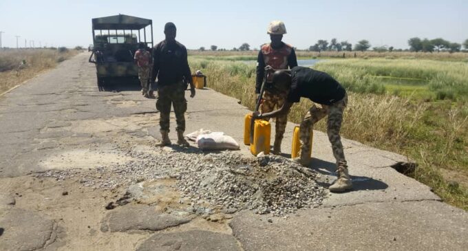 PHOTOS: Soldiers reconstruct road in Borno