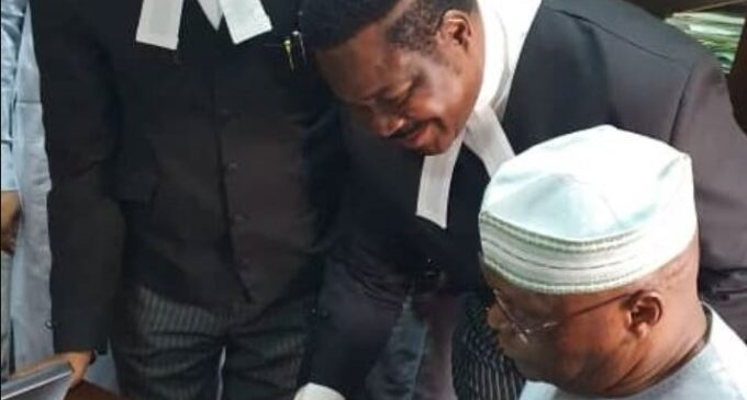 Atiku appears in court, signs N2.5bn libel suit against Buhari’s aide