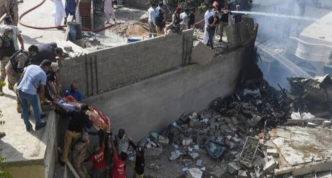 Pakistani aircraft with over 100 passengers crashes in residential area