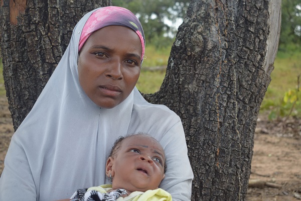 Hauwa with her baby born on the run