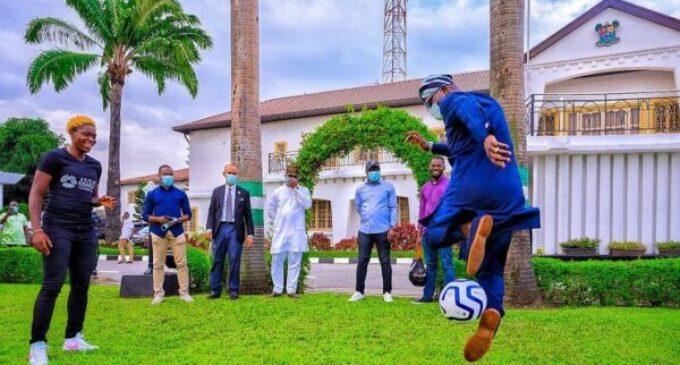 PHOTOS: Sanwo-Olu shows off football skills during Oshoala’s visit