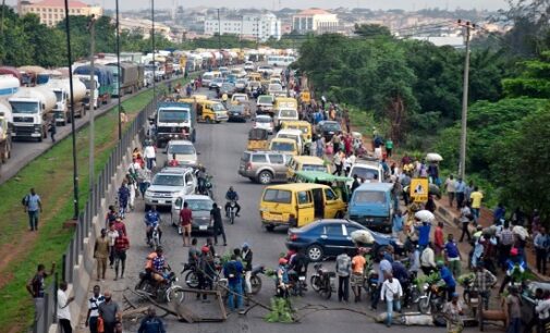 PHOTOS: Travellers stranded as #EndSARS protesters shut Lagos-Ibadan expressway