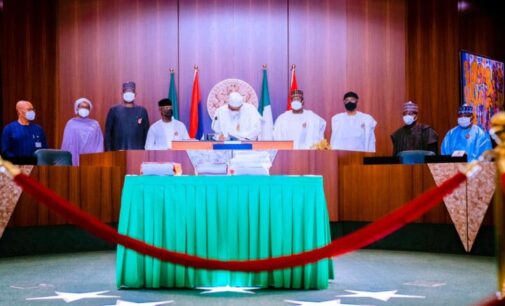 PHOTOS: Buhari signs 2021 budget into law