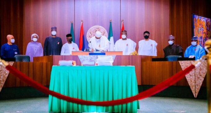 PHOTOS: Buhari signs 2021 budget into law