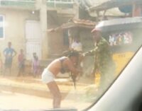 TRENDING VIDEO: Soldier strips lady over ‘indecent dressing’ in Ogun