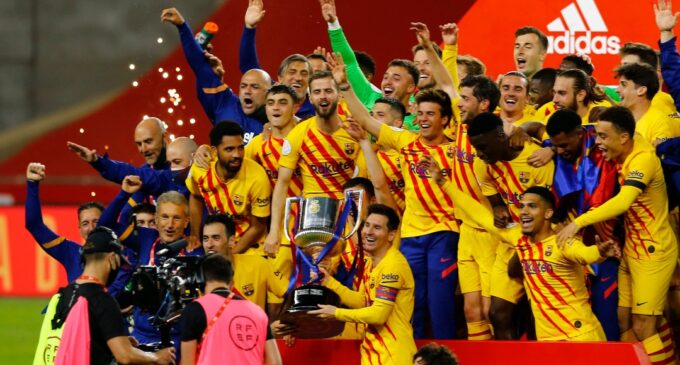 Messi hits brace as Barcelona win first trophy in two years