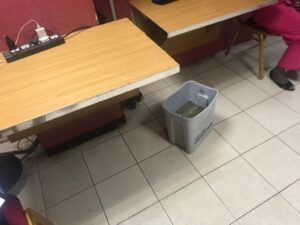 A mopping bucket used to collect water in the leaking press centre 