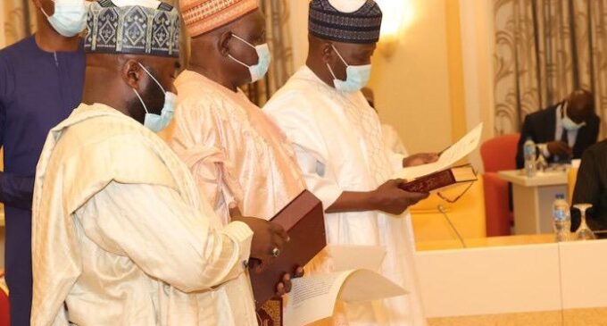 Buhari swears in three INEC commissioners