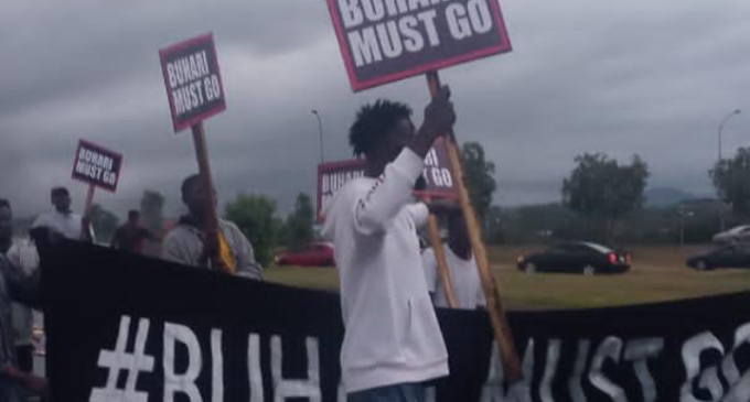 Police fire teargas as #BuhariMustGo protesters hit Abuja streets on Independence Day
